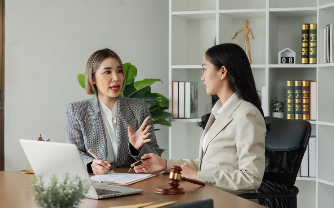 Two people discussing legal documents during a consultation